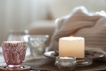 Still life with candles on the table in the living room.