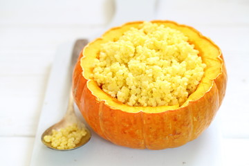 Walking porridge with pumpkin and milk on a white background