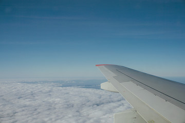 Wing blue sky and clouds in the journey