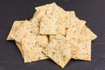 heap of crispy spelt and chickpea cracker with sesame