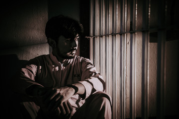 Hands of men desperate to catch the iron prison,prisoner concept,thailand people,Hope to be free.