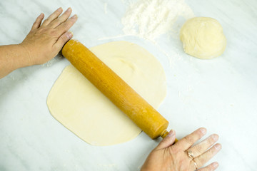 We cook the filling, knead the dough, sculpt the dumplings. Selective focus.