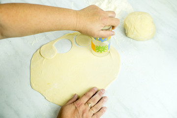 We cook the filling, knead the dough, sculpt the dumplings. Selective focus.