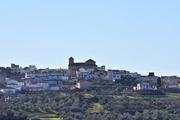 Obraz premium Panoramic view of the Granada town of Nívar with the silhouette of its great church