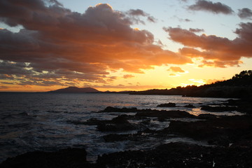 Sunset sea rocks mountain