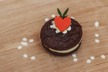 Sponge cake with white cream on a white oak board. Delicious dessert in french.