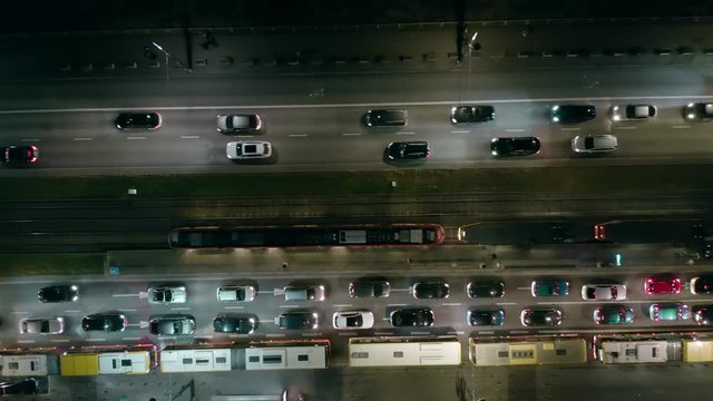 Drone shot shows an impressive hill elevation with traffic at rush hour at night, in Berlin, the development of transport and infrastructure in Germany.