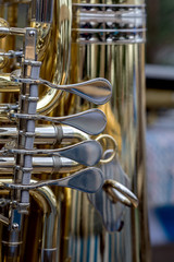 close up of the valves of a tuba