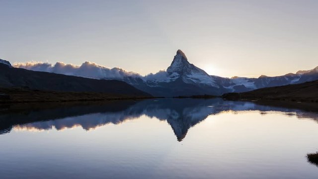 Timelapse of sunset at Stellisee lake and Matterhorn peak. Swiss Alps, Zermatt, Switzerland.