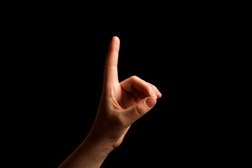 Hand Showing Sign of D Alphabet in American Sign Language (ASL), isolated on black background. Sign language