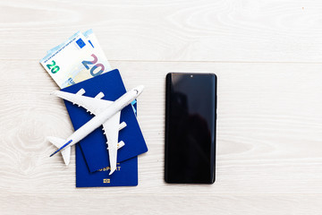 Mockup image of mobile smartphone , airplane and check book isolated on white background. Business technology trip and travel,paycheck concept.