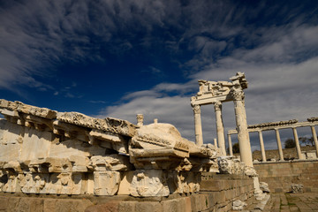 Carved marble pediment among ruins of Temple of Trajan at Pergamon Bergama Turkey