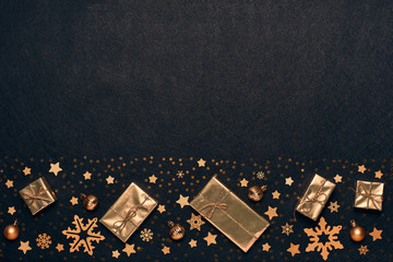 Christmas and New Year background with golden gift boxes and ornaments