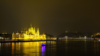 Fototapeta na wymiar Panoramic view on illuminated Hungarian Parliament building and Chain Bridge at night. Budapest, Hungary