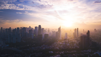 Fototapeta premium Reddish white sunrise or sunset in Jakarta city