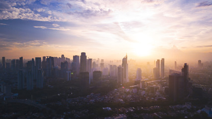 Reddish white sunrise or sunset in Jakarta city