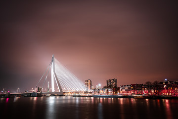Fototapeta na wymiar Rotterdam, Erasmus bridge at night and the river meuse.