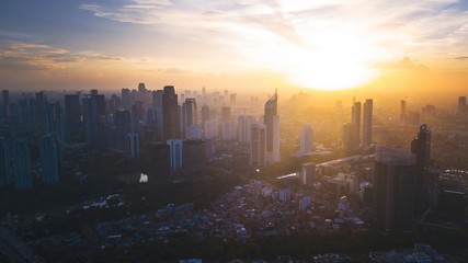Reddish yellow sunset in cityscape of Jakarta