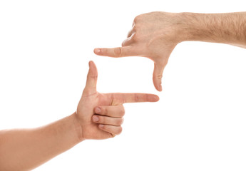 Man making frame with his hands on white background, closeup