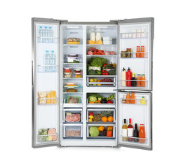 Open refrigerator full of products isolated on white