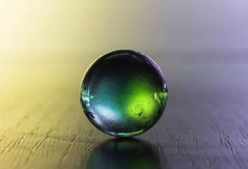 Glass ball in colours. Crystal ball in abstract colours. Magic ball.