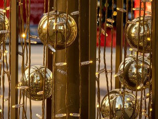 Golden balls and garlands decorate the New Year's installation.