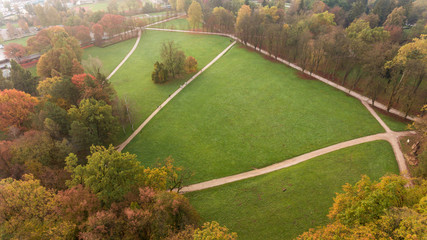 Drop down view of many trails running through trees in a park.