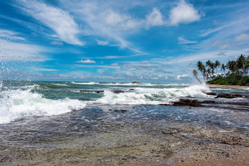 Waves crashing onto the beach at Galle