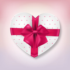 Heart shape gift box with pink ribbon bow