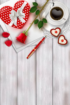 Valentine's day table top view. Present, coffee and red rose on white table with copy space for text.