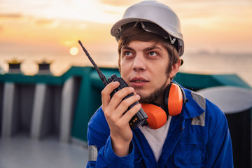 Marine Deck Officer or Chief mate on deck of offshore vessel or ship , wearing PPE personal...