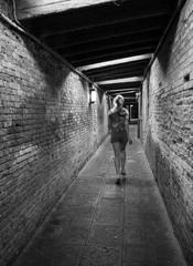 alone woman running in dark  tunnel. - 311239013