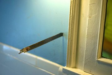 A saw blade in the wall.
