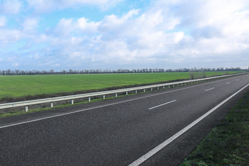 Beautiful view of asphalt highway without transport