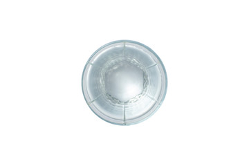 Glass with clear crystal water on a white isolated background. The concept of thirst, heat, summer. Flat lay, top view