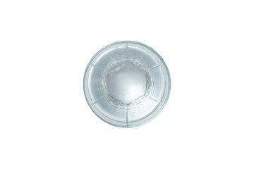 Naklejka premium Glass with clear crystal water on a white isolated background. The concept of thirst, heat, summer. Flat lay, top view