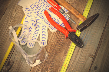 locksmith tools - old pliers, hammer, screwdriver