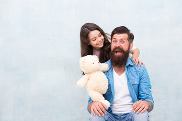 Best friends forever. Father and daughter play with soft toy. Small child and dad enjoy friendship. Happy friends. Playing games. Friends and family. Friends complement each other, copy space