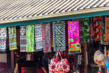 Fototapeta na wymiar Multi-colored fabrics in the local market, Fiji.