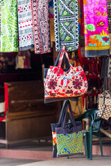 Multi-colored fabrics in the local market, Fiji. Vertical. With selective focus.