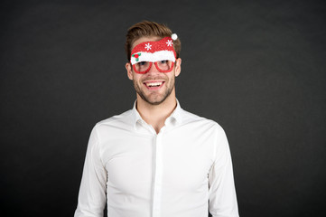 Happy holidays. Merry christmas. Man white shirt posing with photo booth props. Winter holidays. Corporate party. Santa claus coming. Guy celebrate new year. Cheerful ideas for holidays celebration