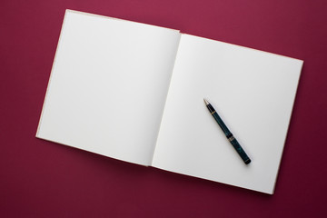 Empty Book with pen on desk