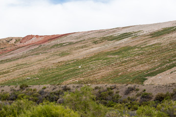 Large tailing piles from modern gold and silver mining operation