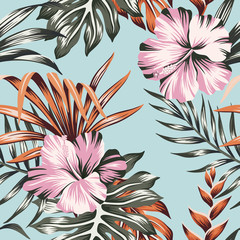 Tropical floral pink hibiscus flower orange palm leaves seamless pattern blue background. Exotic jungle wallpaper.