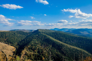 Beautiful mountain landscape, with mountain peaks covered with forest and a cloudy sky. Ukraine mountains, Europe