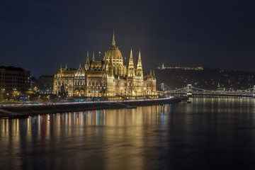 Fototapeta na wymiar Incredible Evening View of Budapest parliament and Danube river at sunset, Hungary.