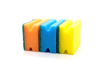 Three multi-colored sponges for washing dishes on a white background