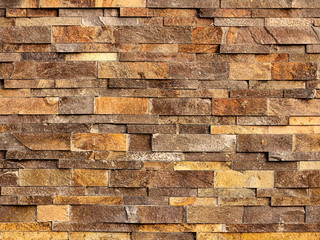 backround texture of yellow-brown rough brick wall