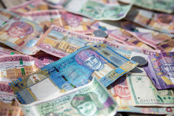 Obraz na płótnie Canvas Closeup view of different banknotes and coins of omani rials