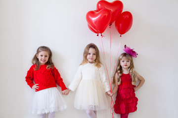 Children with red balloons on birthday party